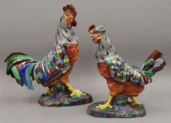 A pair of decorative porcelain figures, one of a cockerel, the other a chicken.