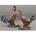 A pair of decorative porcelain figures, one of a cockerel, the other a chicken.