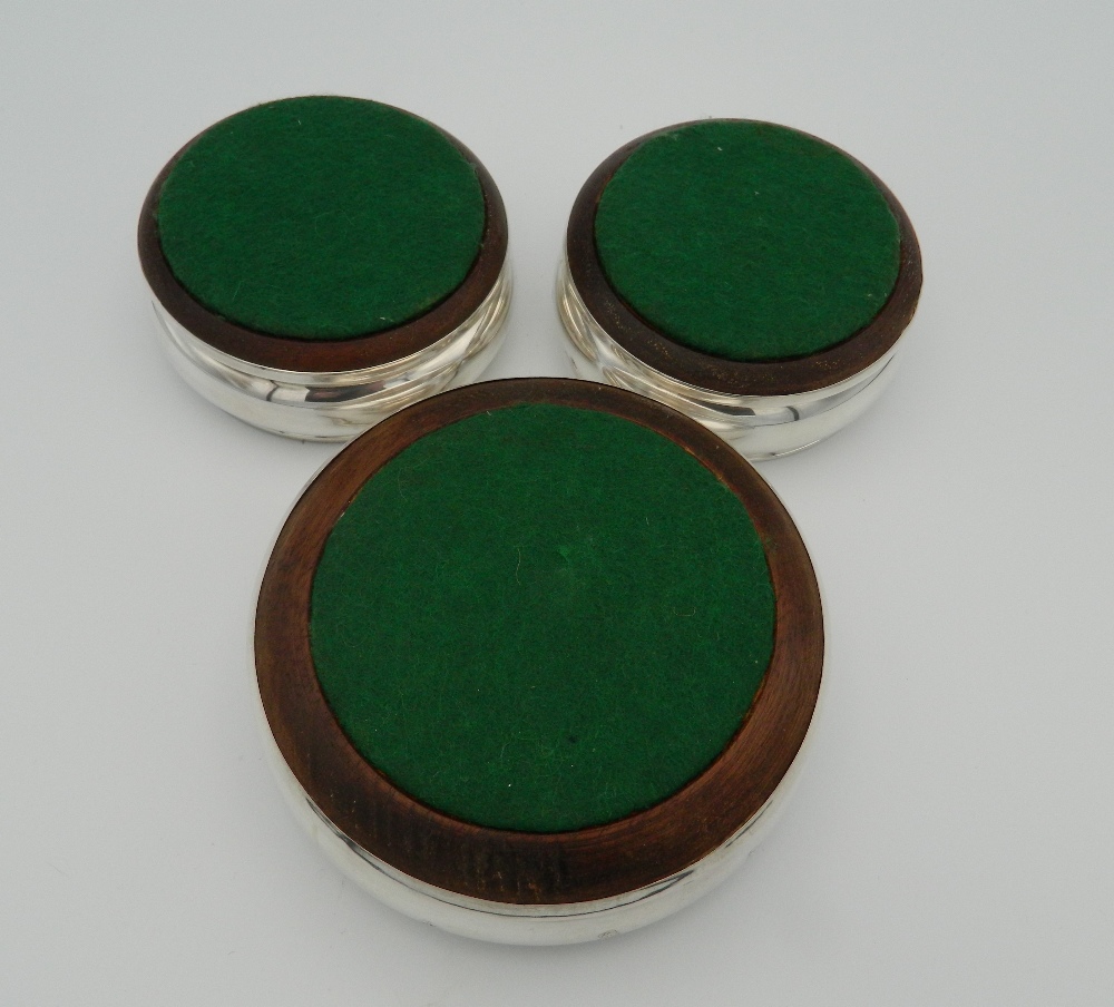 A trio of silver and wood coasters, - Image 3 of 4