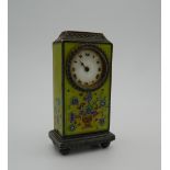 An enamelled decorated miniature Continental silver desk clock. 6.75 cm high.