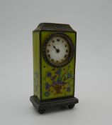 An enamelled decorated miniature Continental silver desk clock. 6.75 cm high.