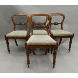 A set of four Victorian rosewood balloon back dining chairs. 46 cm wide.