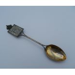 An Edward VII Coronation spoon inset with a stamp. 13 cm long (13 grammes total weight).