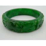 An apple green jade bangle. 7.5 cm diameter.