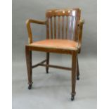An early 20th century oak desk chair. 55 cm wide.
