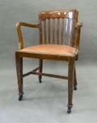 An early 20th century oak desk chair. 55 cm wide.