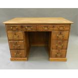 A Victorian pitch pine desk. 113 cm wide.