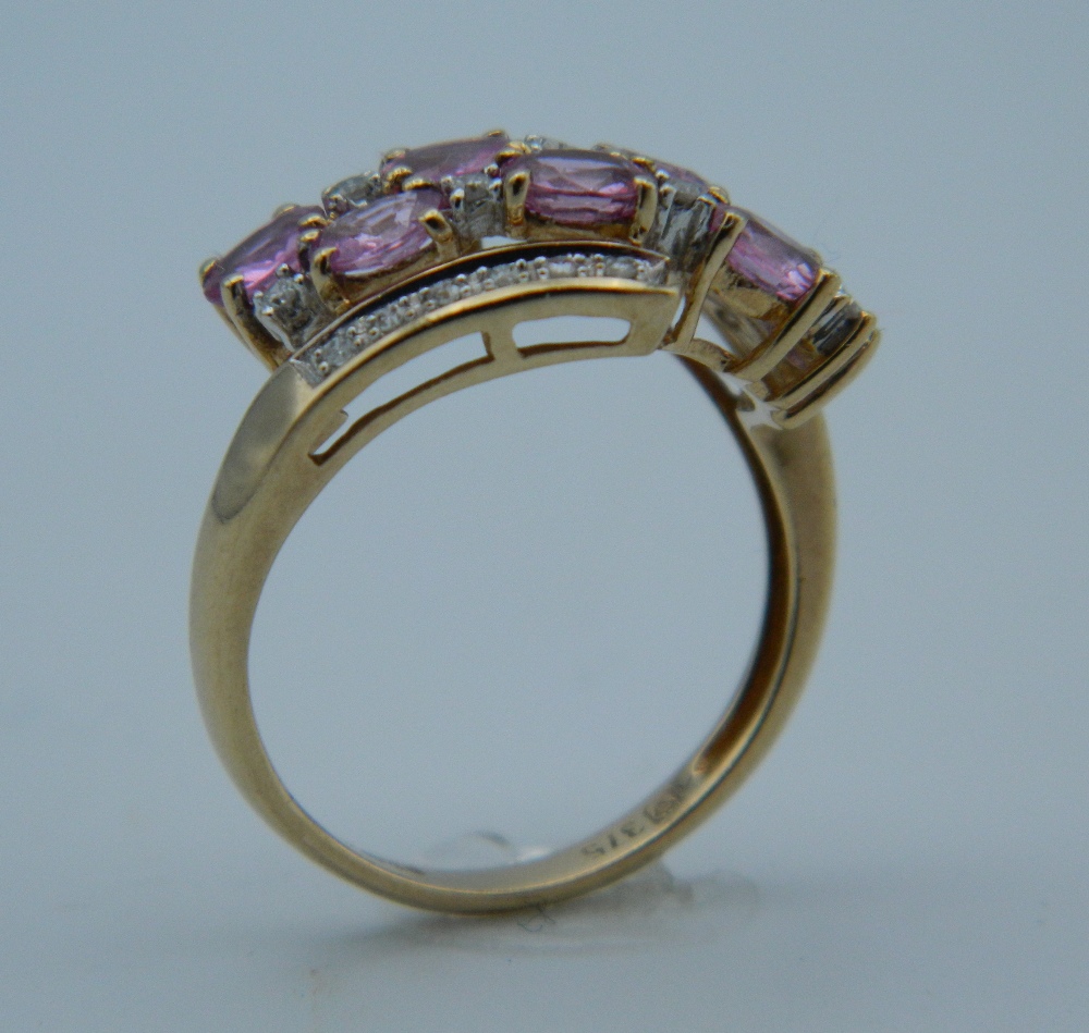 A 9 ct gold diamond and pink sapphire ring. - Image 3 of 4