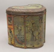 A Huntley and Palmers travelling showman biscuit tin. 16.5 cm high.