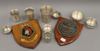 Two military plaques and a quantity Arabic toasting cups. The plaques 18 cm high.