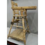 A Victorian child's folding highchair. 96 cm high.