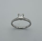 A platinum princess cut diamond ring. Diamond approximately 35 pts of carat. Ring size J.