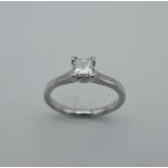 A platinum princess cut diamond ring. Diamond approximately 35 pts of carat. Ring size J.