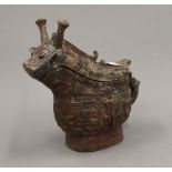 A Chinese archaic type bronze lidded jug. 19 cm high.