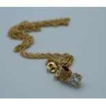 A 1/4 carat diamond solitaire pendant on a 9 ct gold chain (2.