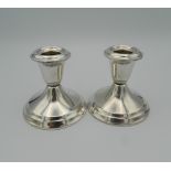 A small pair of Gorham sterling silver candlesticks. 8 cm high (15.6 troy ounces weighted).