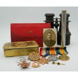 A set of WWI medals, badges, bayonet, a Princess Mary 1914 Christmas tin, paperwork, etc.