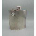 An Art Deco engine turned hallmarked silver spirit flask, Birmingham 1924. 12 cm high (4.