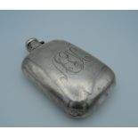 A silver hip flask. 15 cm high (5.2 troy ounces).