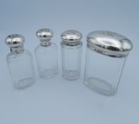 Two silver and cut glass screw top scent flasks,