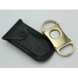 A cased cigar cutter. 8 cm long.