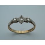 A 9 ct gold and diamond ring. Ring Size S (2.