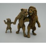 A cold painted bronze model of a lion group. 6 cm high.