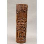 A Chinese carved bamboo brush pot. 38.5 cm high.