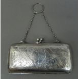 A silver purse. 11.75 cm wide, 6.5 cm high (76.