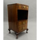 A walnut bow fronted pot cupboard. 75 cm high.