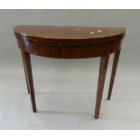 A mahogany demi lune tea table. 95 cm wide.