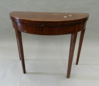 A mahogany demi lune tea table. 95 cm wide.