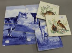 A quantity of Mintons blue and white tiles depicting cattle and two tiles depicting game birds.