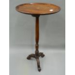 A Victorian mahogany tripod table. 41 cm diameter.