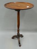 A Victorian mahogany tripod table. 41 cm diameter.