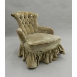 A Victorian button back upholstered nursing chair. 64 cm wide.