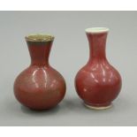 A late 19th/early 20th century Chinese Sang De Boeuf vase and another similar.