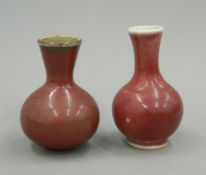 A late 19th/early 20th century Chinese Sang De Boeuf vase and another similar.