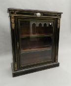 A Victorian ebonised ormolu porcelain mounted pier cabinet. 87 cm wide.