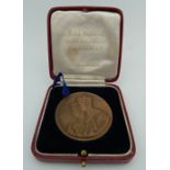 A George VI Coronation medallion, cased.