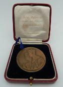 A George VI Coronation medallion, cased.