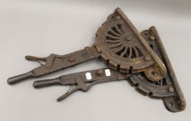 Two Victorian cast iron conservatory levers. 48 cm high.