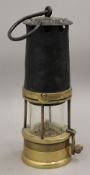 A vintage miners lamp. 25 cm high.