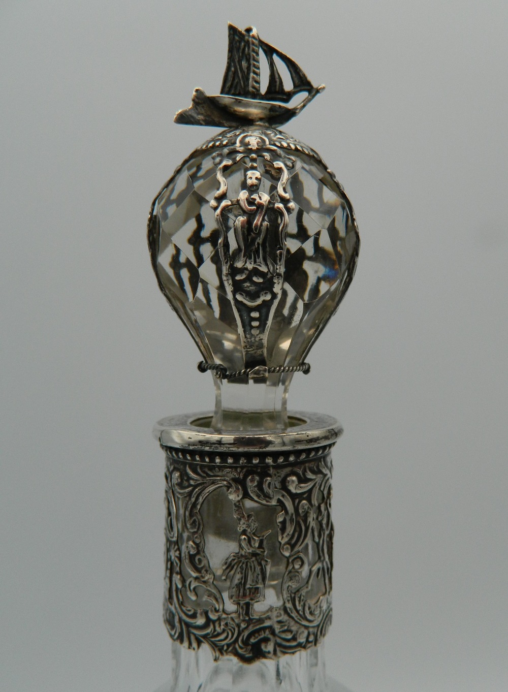 A Continental silver and cut glass decanter and stopper, the silver applied with figures, - Image 2 of 5