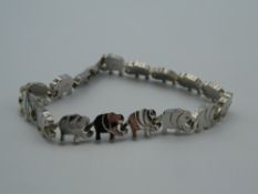 A silver bracelet with elephant links. 18 cm long.