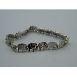 A silver bracelet with elephant links. 18 cm long.