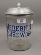 A Meredith and Drew shop counter biscuit jar. 23 cm high.