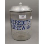 A Meredith and Drew shop counter biscuit jar. 23 cm high.