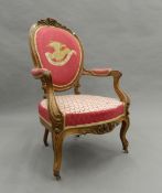 A tapestry covered 19th century walnut open armchair. 62 cm wide.