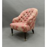 A Victorian pink florally upholstered button tub armchair. 63 cm wide.